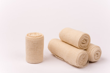Fototapeta na wymiar Bunch of new bandage rolls over white background