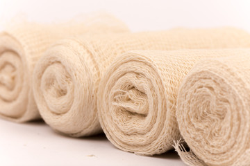 Fototapeta na wymiar Bunch of new bandage rolls over white background