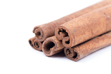 Cinnamon sticks isolated over white background