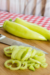 Sliced green paprika on the wooden board