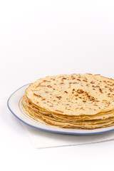 Homemade pancakes on the plate. Isolated on white background.