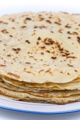 Homemade pancakes on the plate. Isolated on white background.