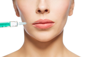 woman face and syringe making injection
