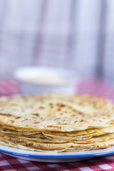 Homemade pancakes on the plate with blurred background