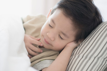 Cute asian child lying