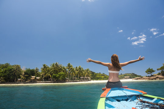 Woman on a traditional Indonesian boat trip to Marak Island near Padang in West Sumatra, Indonesia