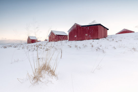 Fresh snow surrounds the typical fishermen houses called Rorbu in winter, Eggum, Vestvagoy (Vest-Vagoy) Island, Lofoten Islands, Arctic