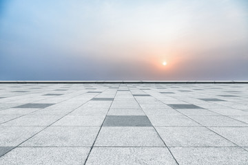 empty tiled floor against sunset