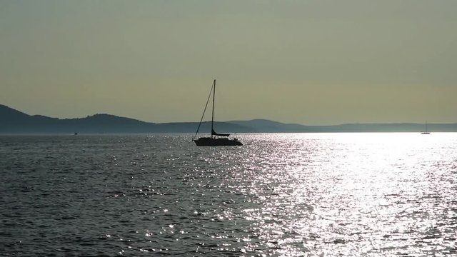 boat in the sea at sunset in Zadar, Croatia