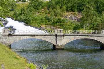 Bridge in Hellesylt on rushing mountain river. Norway