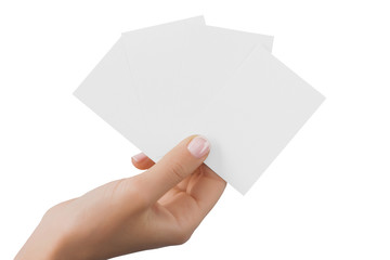 Business cards in female hand isolated at white background.