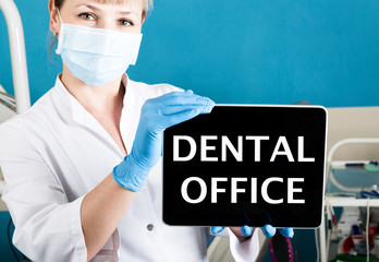 technology, internet and networking in medicine concept - femail dentist holding a tablet pc with...