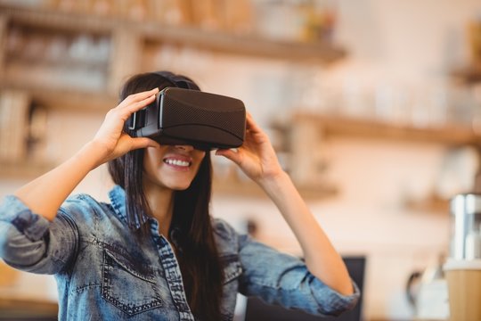 Young woman using the virtual reality headset