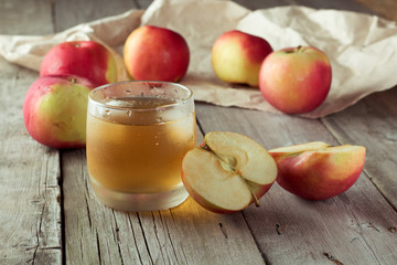 sliced apple and juice in background