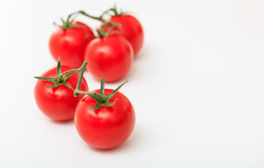 cherry tomatoes on a white background