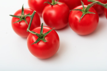 cherry tomatoes on a white background