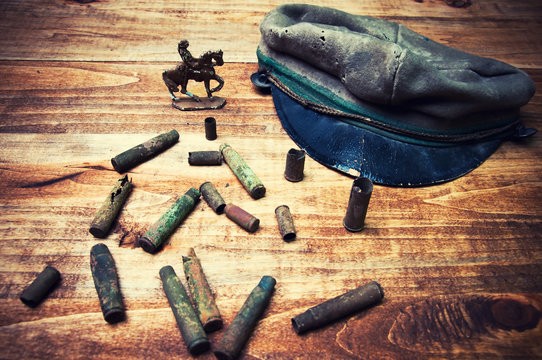 Old cartridge shells and military cap