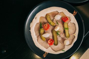 Sliced beef tongue with horseradish and vegetable
