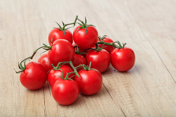 cherry tomatoes on a wooden surface