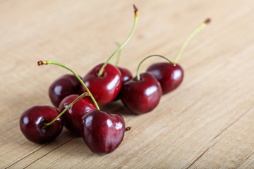 cherries on a wooden surface
