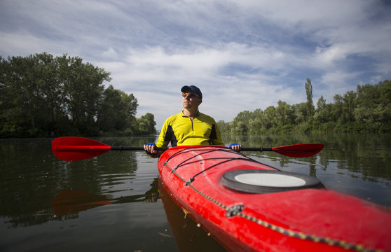 A man traveling by kayak.