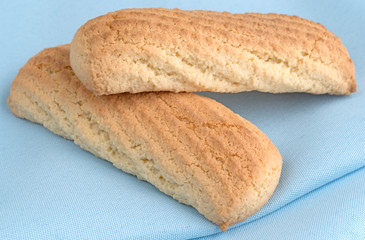 Vanilla cookie bars on a blue napkin close view.