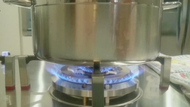 inox pot on gas cooker in the kitchen