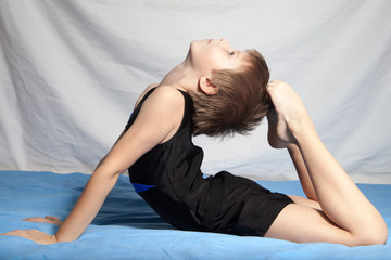 The boy doing gymnastics