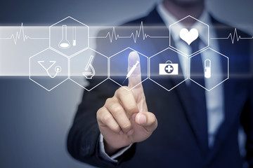 Close up of businessman touching digital screen with finger