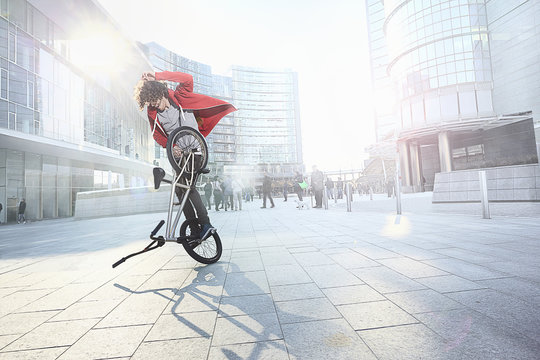 BMX Biker doing stunt in urban area