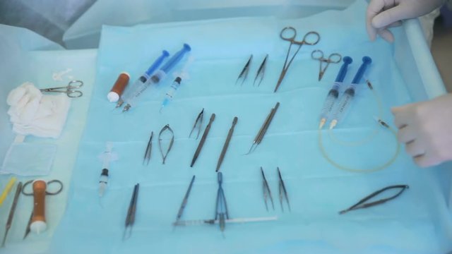 Surgical tool on table in an operating room. 1080p.