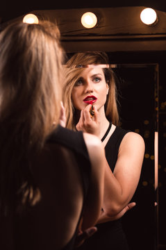 Wearing red lipstick