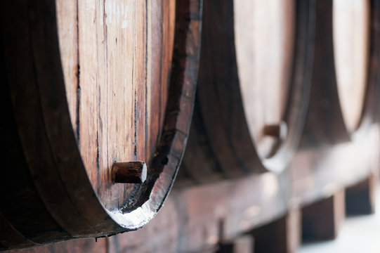 Old wine barrels in the wine cellar, Madeira island, Portugal. 