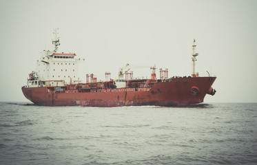 Cargo ship sailing in still water