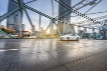 motion blurred traffic at steel bridge