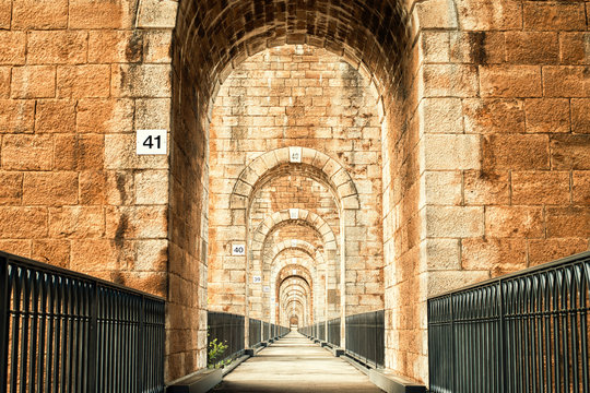 Path through the arches of the Chaumont Viaduct, France