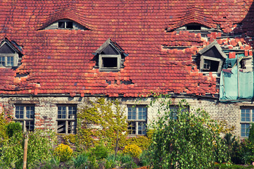 Old orange brick roof with retro windows