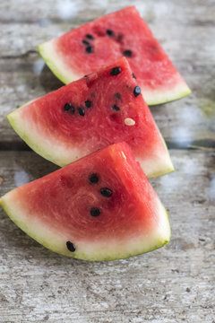 Watermelon pieces on the old board