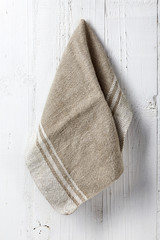 Clean and soft towel hanging at bathroom wall