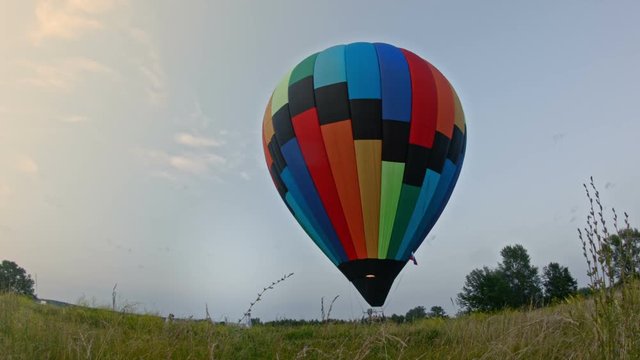 photographer photographing a couple near hot airballoon