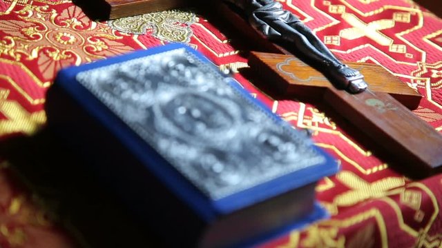 Orthodox items.Orthodox cross with bible in church