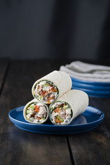 Tuna burritos with avocado tomato and mayonnaise