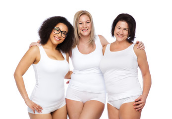 Fototapeta na wymiar group of happy plus size women in white underwear