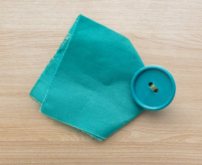 Piece of blue cloth with button