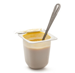 Open yogurt in pot with metal spoon
