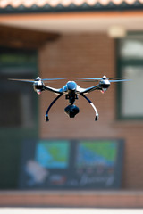 drone flying near house - obrazy, fototapety, plakaty