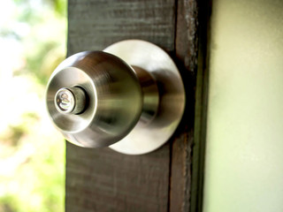 Steel door knob on wooden
