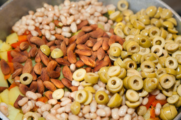 Closeup of sabzi with almonds and olives