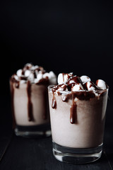 Homemade Hot Chocolate. A cup with hot chocolate, marshmallows and bar chocolate.
