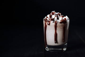 Homemade Hot Chocolate. A cup with hot chocolate, marshmallows and bar chocolate.
